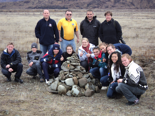 We made a pile of rocks on the side of the road, because
        that’s what all the tourists did, so we made a huge one. This picture is of all the cadets and officers on the trip.